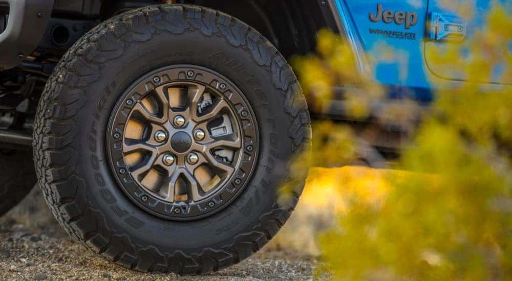 Close-up of a tire with rim on a used 2025 Jeep Wrangler Rubicon 392
