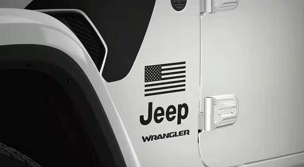 Close-up of the American flag decal on a white 2025 Jeep Wrangler Freedom Edition.