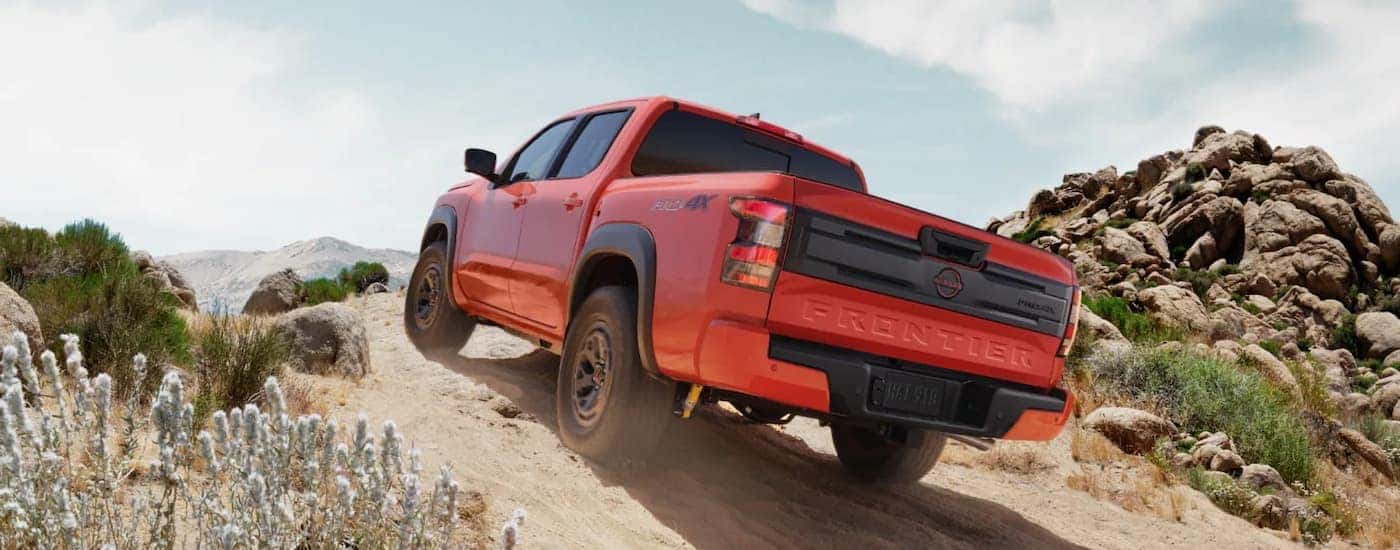 An orange 2025 Nissan Frontier PRO-4x off-roading