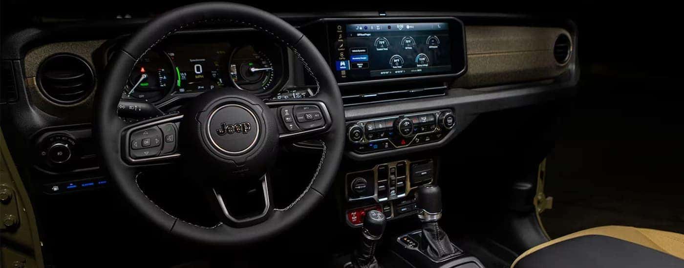 The interior dash of a used 2025 Jeep Wrangler Rubicon for sale