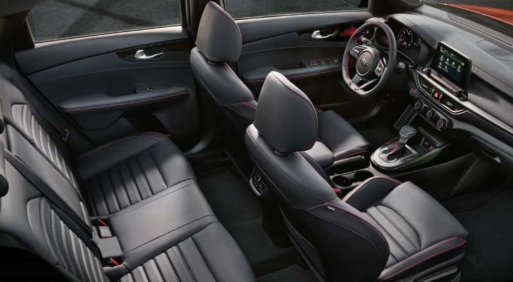 The gray interior and dash in a used 2021 Kia Forte for sale.