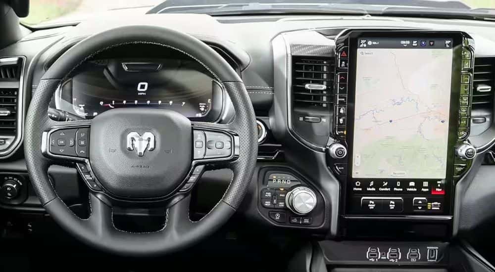 Infotainment and digital gauge cluster on a used 2025 Ram 1500