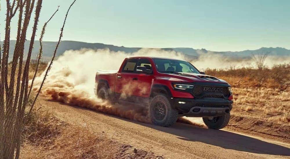 A red 2023 Ram 1500 TRX off-roading.
