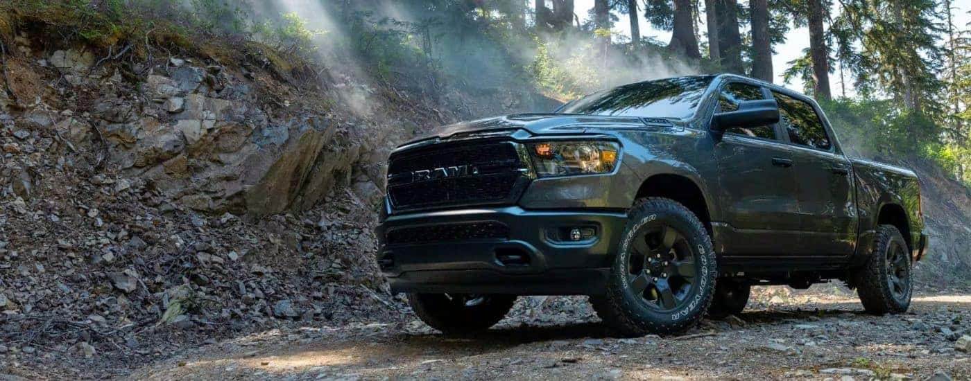 A dark gray used 2023 Ram 1500 Warlock Edition parked off-road