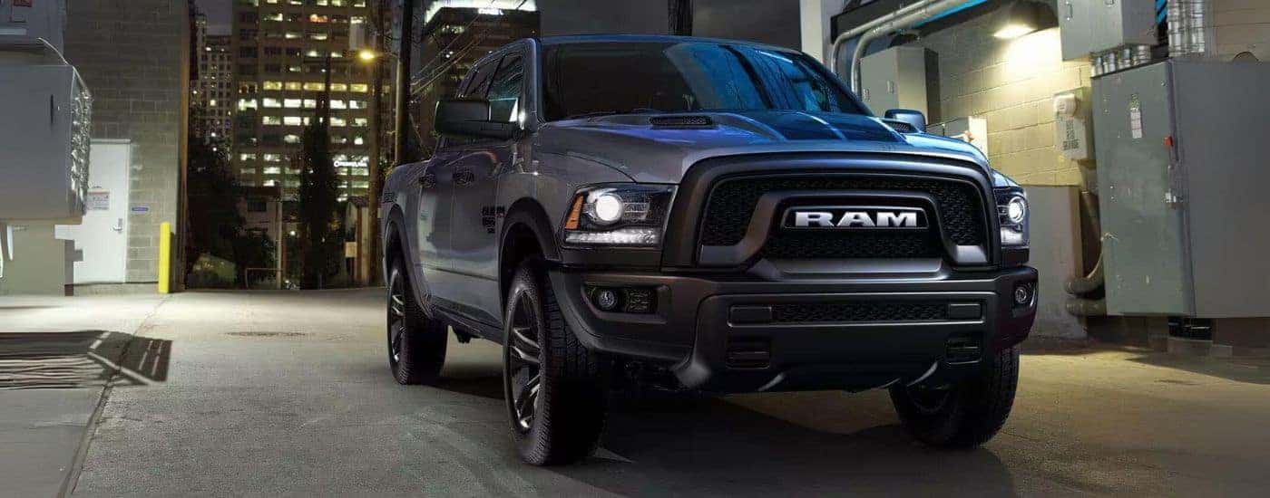 A black used 2023 Ram 1500 Classic for sale parled in a city
