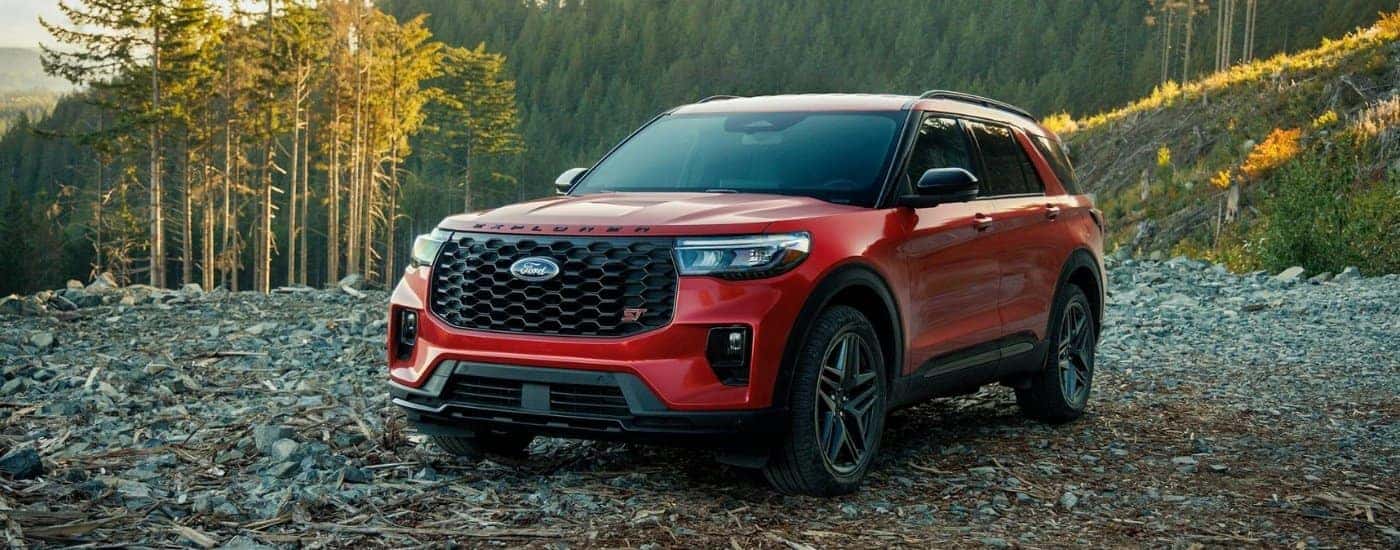 A red 2025 Ford Explorer for sale from the front.