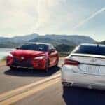 Two 2018 Toyota Camry XSE pass each other on the road.