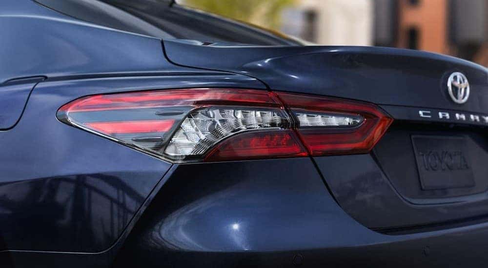 The taillight on a blue 2024 Toyota Camry.