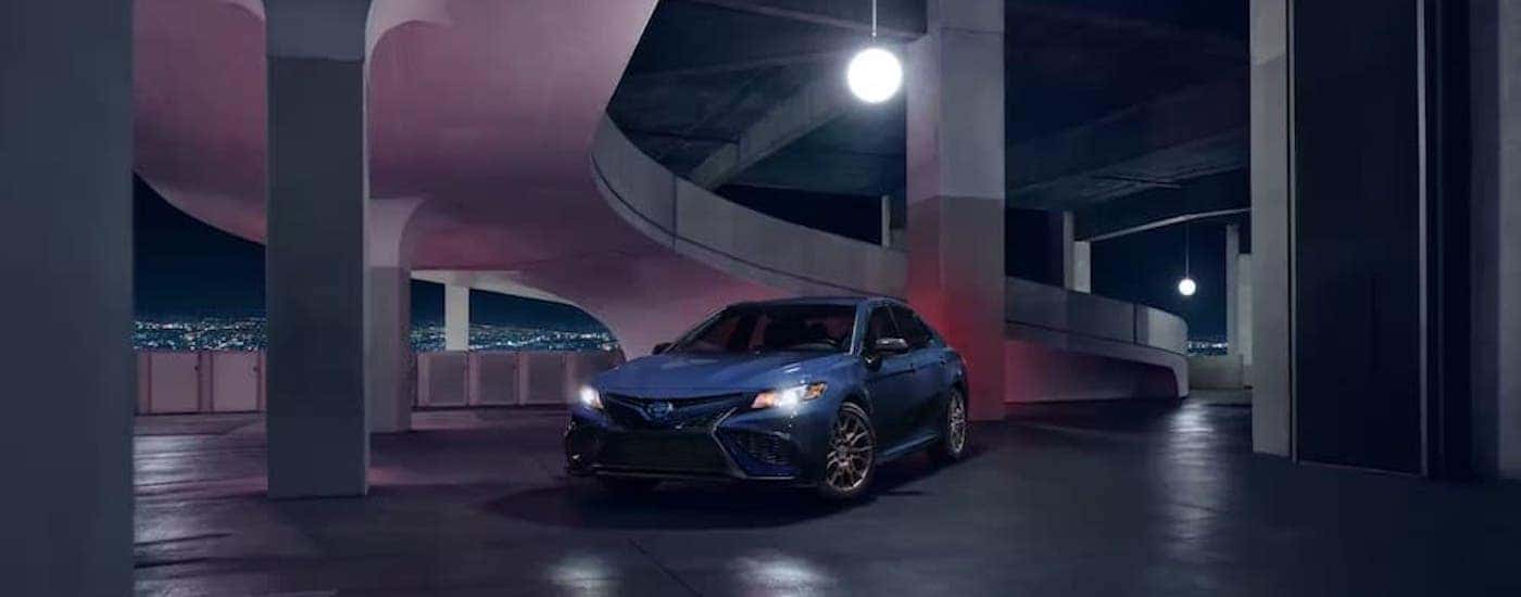 A blue 2023 Toyota Camry from the front.