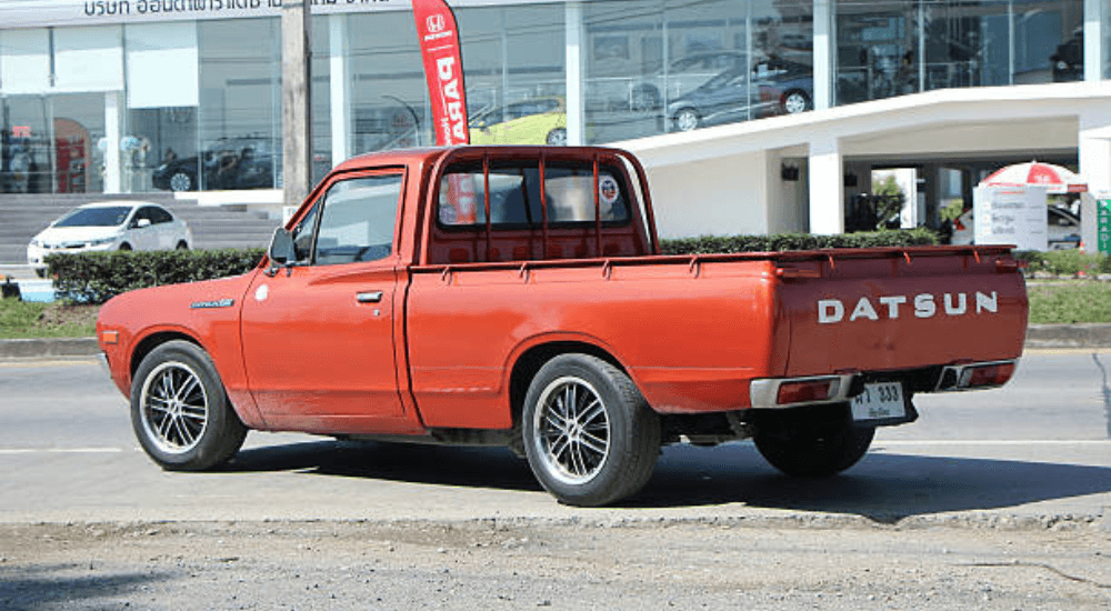 Red 1976 Datsun 620 from the rear