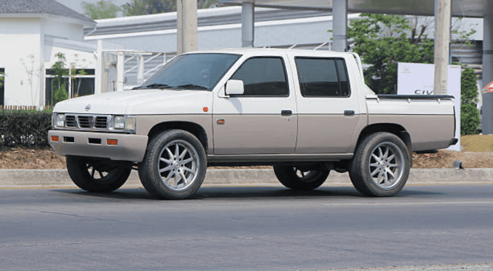 White 1997 Nissan Hardbody D20 from the side
