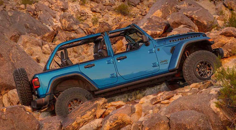 Blue 2021 Jeep Wrangler Rubicon 392 driving off road
