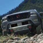 Grey 2024 Nissan Frontier PRO driving off road