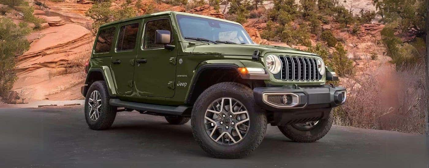 Green 2024 Jeep Wrangler Sahara Unlimited parked for sale near Knoxville parked after a test drive