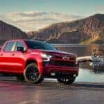 A red 2022 Chevy Silverado 1500 Z71 parked near a dock.