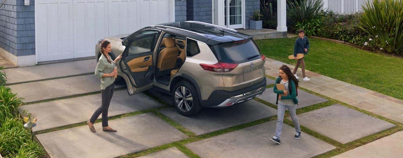 A bronze 2023 used Nissan Rogue for sale in Knoxville from the rear.