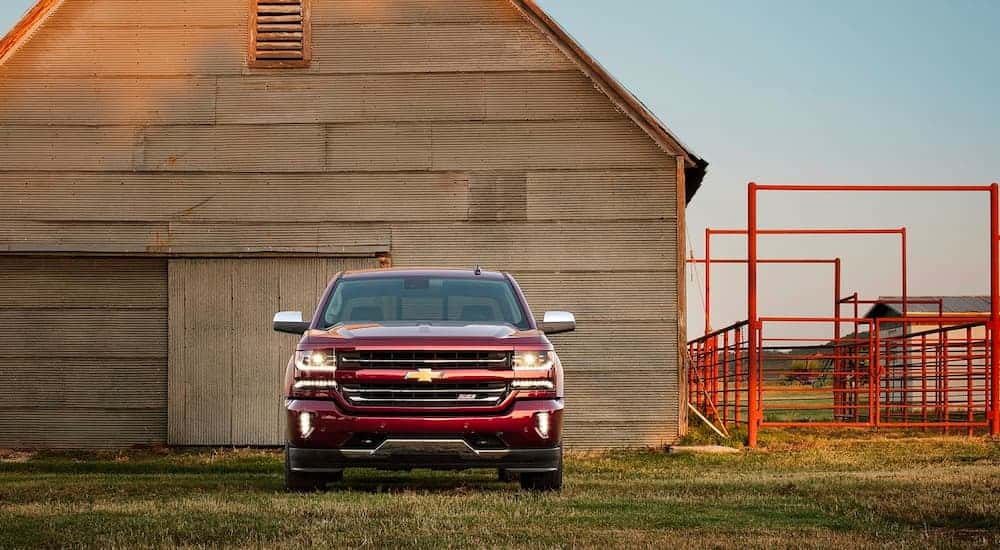 A used red 2016 Chevy Silverado 1500 for sale parked outdoors.