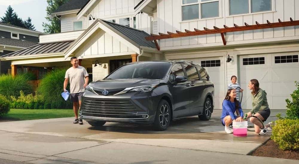 A gray 2025 Toyota Sienna parked on a driveway.