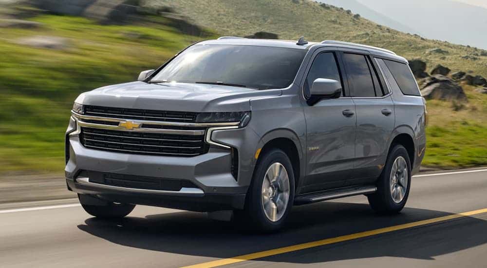 A silver 2021 Chevy Tahoe driving down a highway