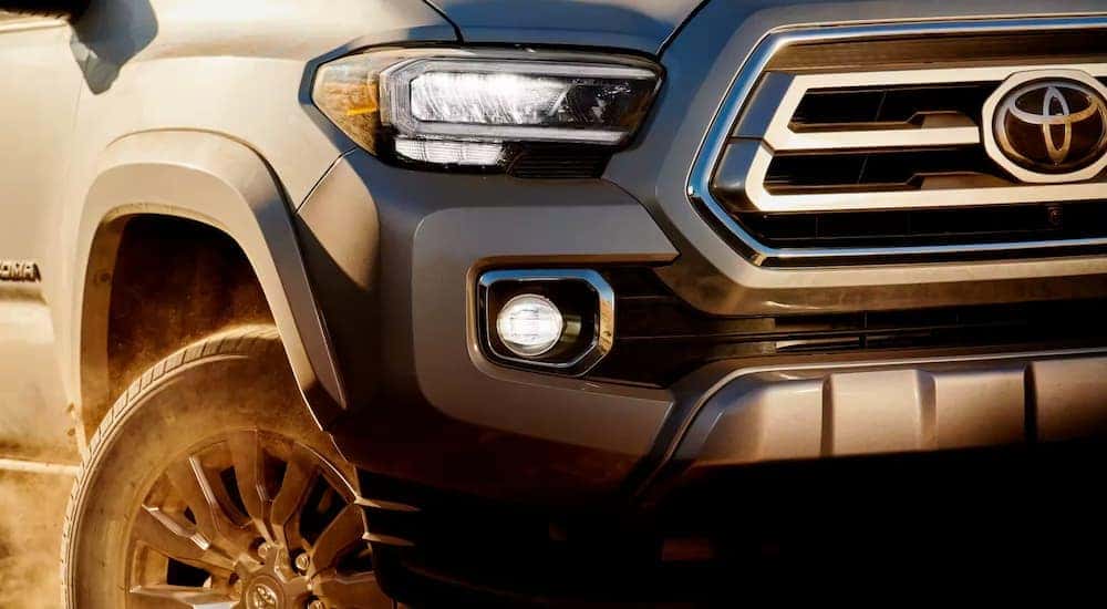 Front and headlight on a grey 2023 Toyota Tacoma