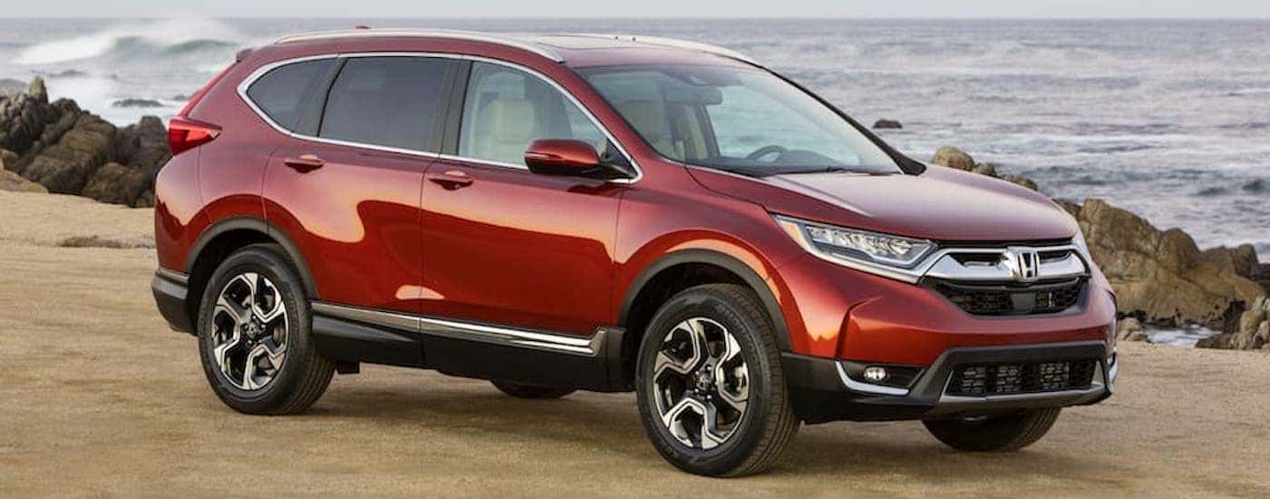 Red 2017 Honda CR-V parked near the ocean