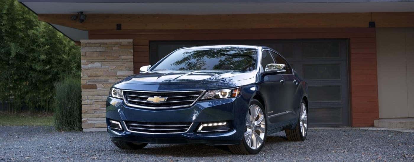 Blue 2018 Chevy Impala parked on a driveway