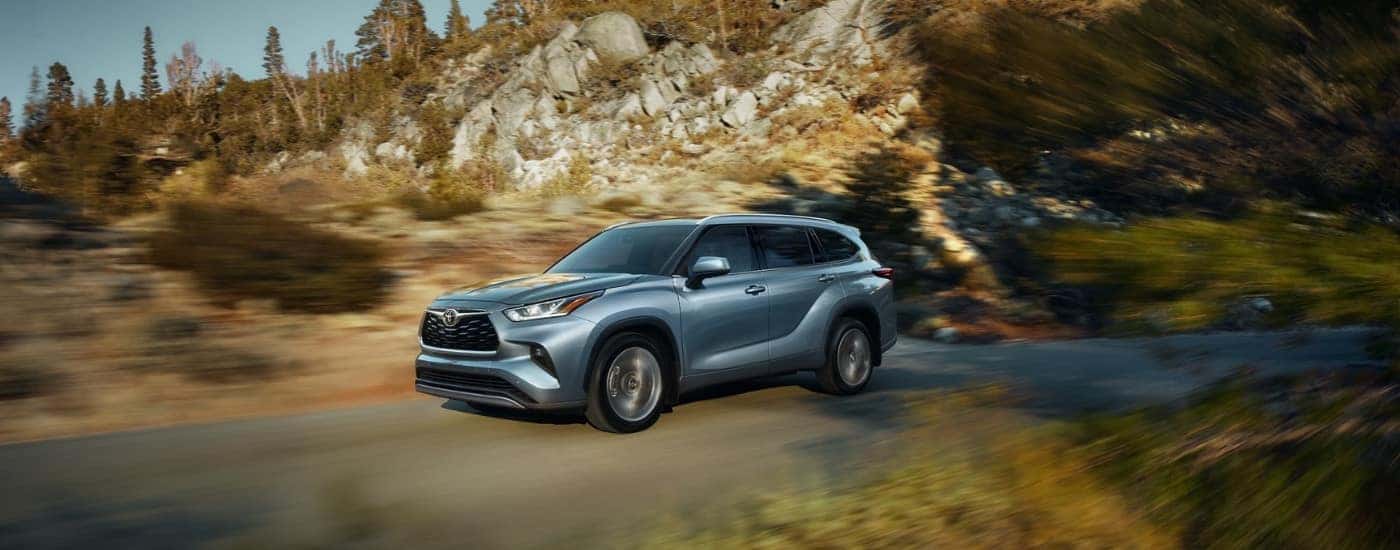 Silver 2020 Toyota Highlander driving through a rocky landscape