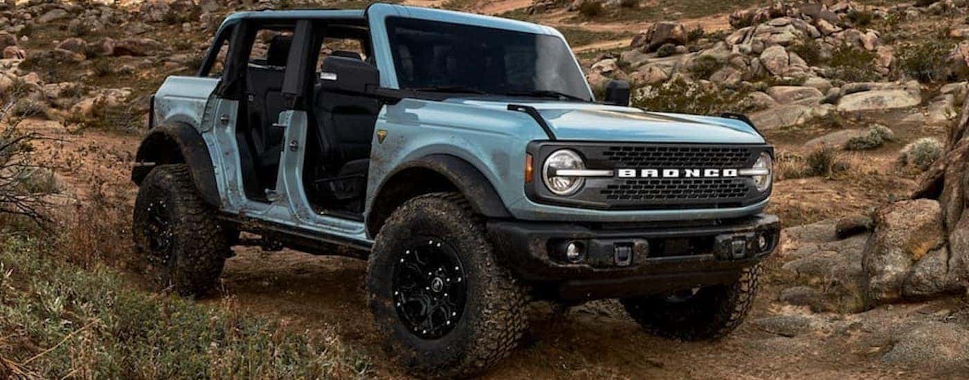Blue 2021 Ford Bronco 4-door on rough terrain