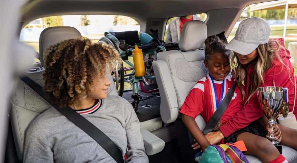 A 2026 Ford Explorer with loaded cargo and passengers in the rear seats