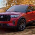 Red 2026 Ford Explorer on a road in the fall
