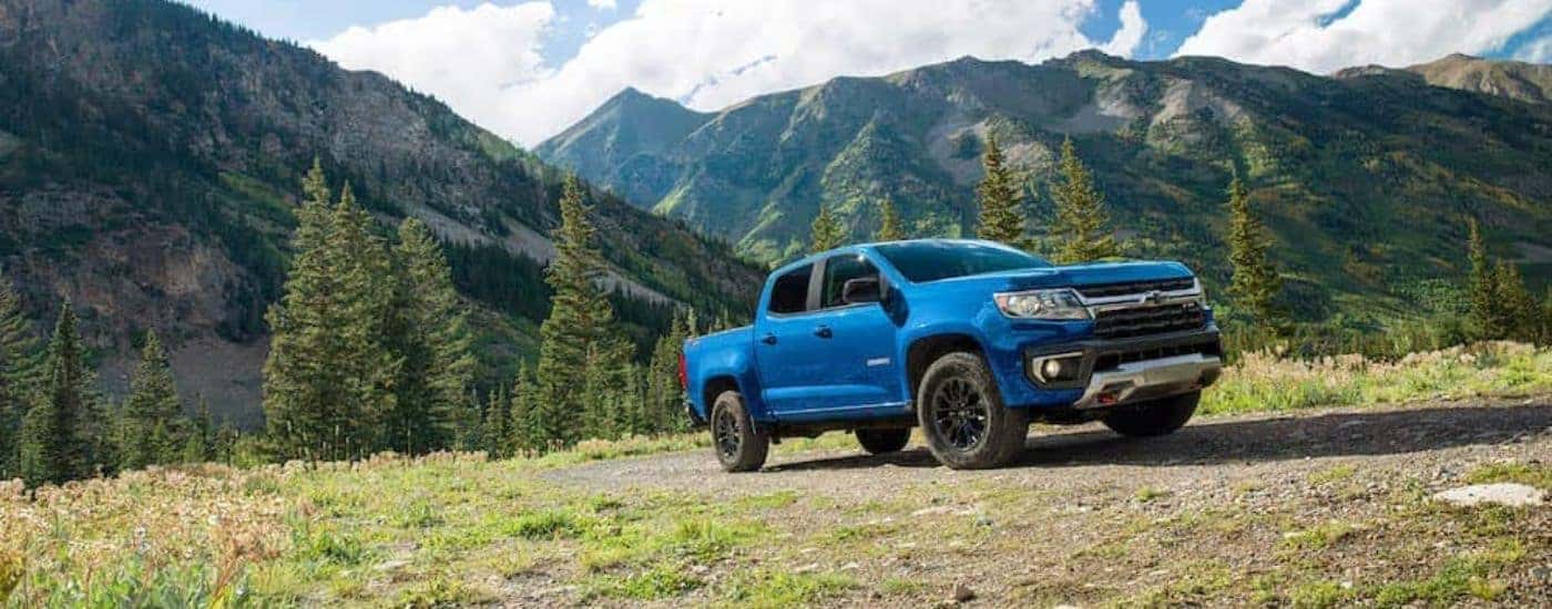 A blue 2022 Chevy Colorado Z71 parked on an open field.