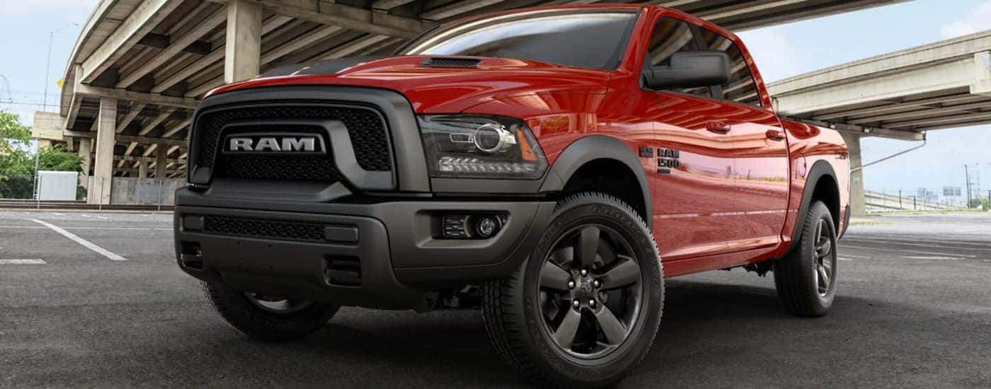 Red 2019 Ram 1500 Classic parked on a brick road.