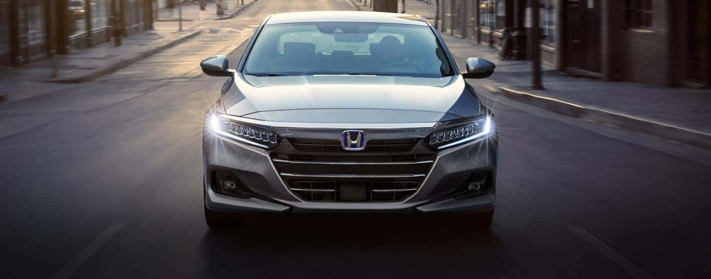 A grey 2021 Honda Accord is shown from the front.