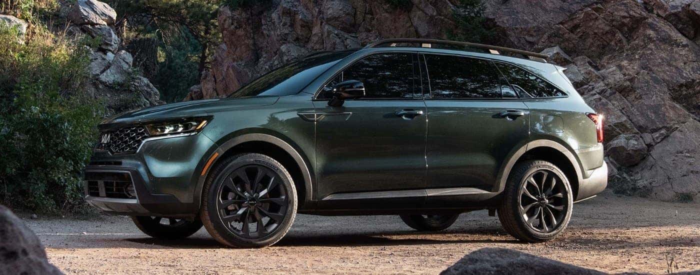 A green 2022 Certified Pre-Owned Kia Sorento X-Line is shown from the side.