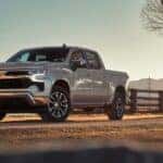 Silver 2023 Chevy Silverado 1500 parked near a fence