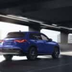 Blue 2023 Honda HR-V driving through a parking garage.