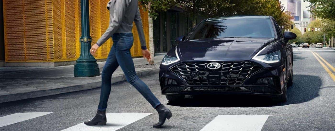 Black 2023 Hyundai Sonata at crosswalk