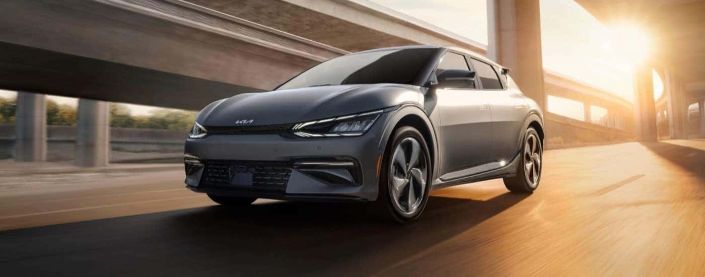 Grey 2023 Kia EV6 driving on an overpass