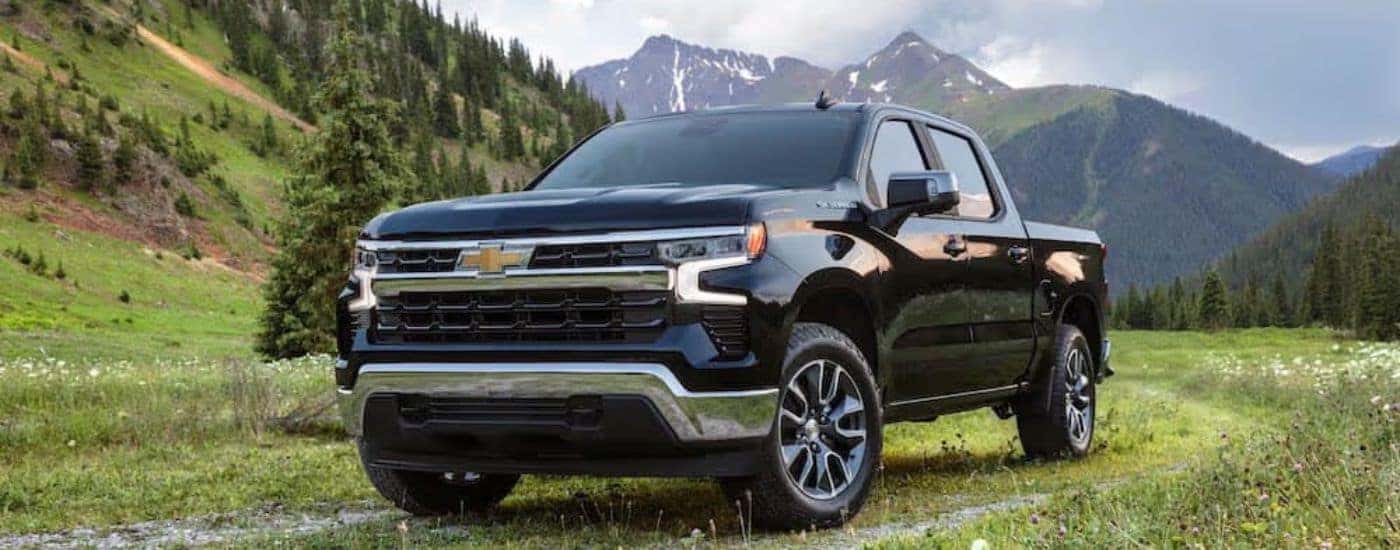 A black 2022 Chevy Silverado 1500 is shown from the front at an angle.