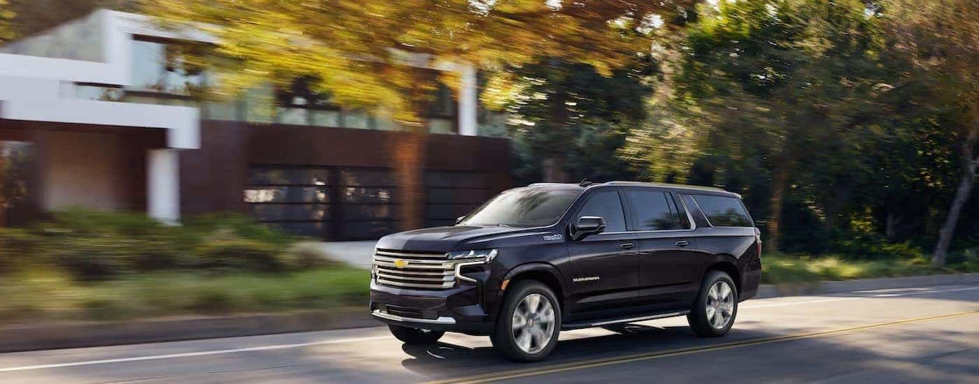 Black 2022 Chevy Suburban shown from the side.