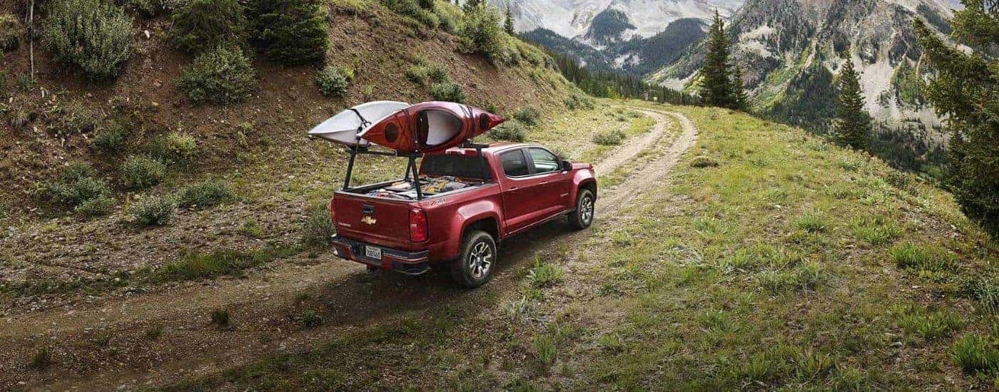 Red 2019 Chevy Colorado Z71 driving on a mountain trail