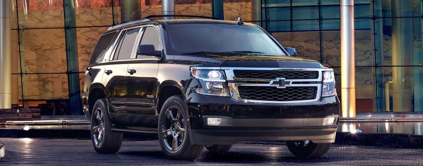 Black 2017 Chevy Tahoe parked in front of a building