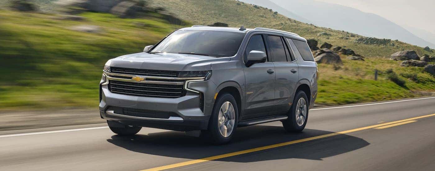 Silver 2021 Chevy Tahoe on an open road