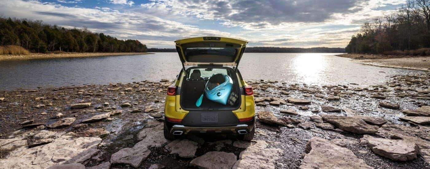 An open hatchback on a yellow 2024 Chevy Trailblazer.
