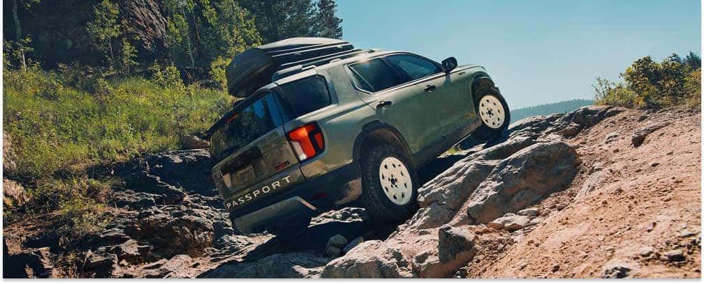 Green 2026 Honda Passport TrailSport Off-Roading