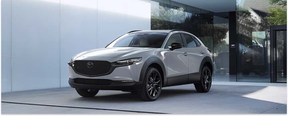 White 2026 MAZDA CX-30 Parked In Front of Building