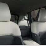 Interior seating of a 2026 Mazda CX-5 featuring two-tone Pure White and black upholstered seats.
