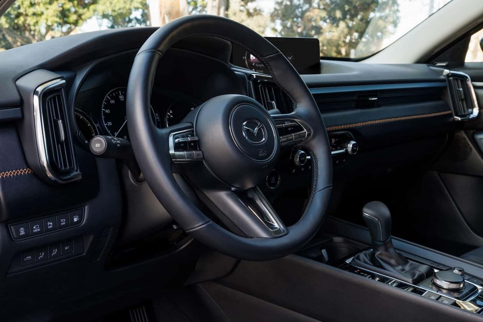 MAZDA CX-50 Interior photo of steering wheel and tech