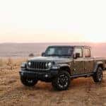 Sideview of Jeep Gladiator parked in dry grassland