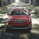 Red Jeep Cherokee in a Forest